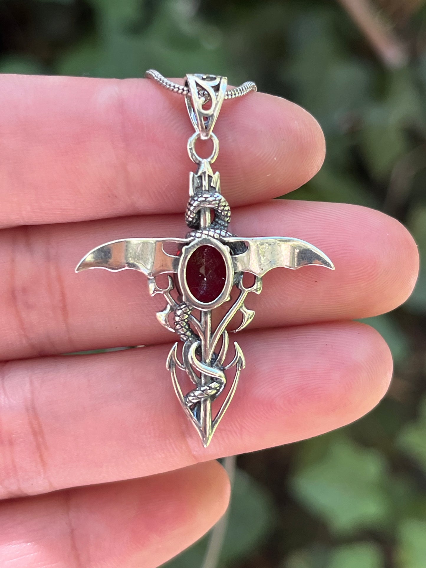 Sterling silver faceted garnet snake cross